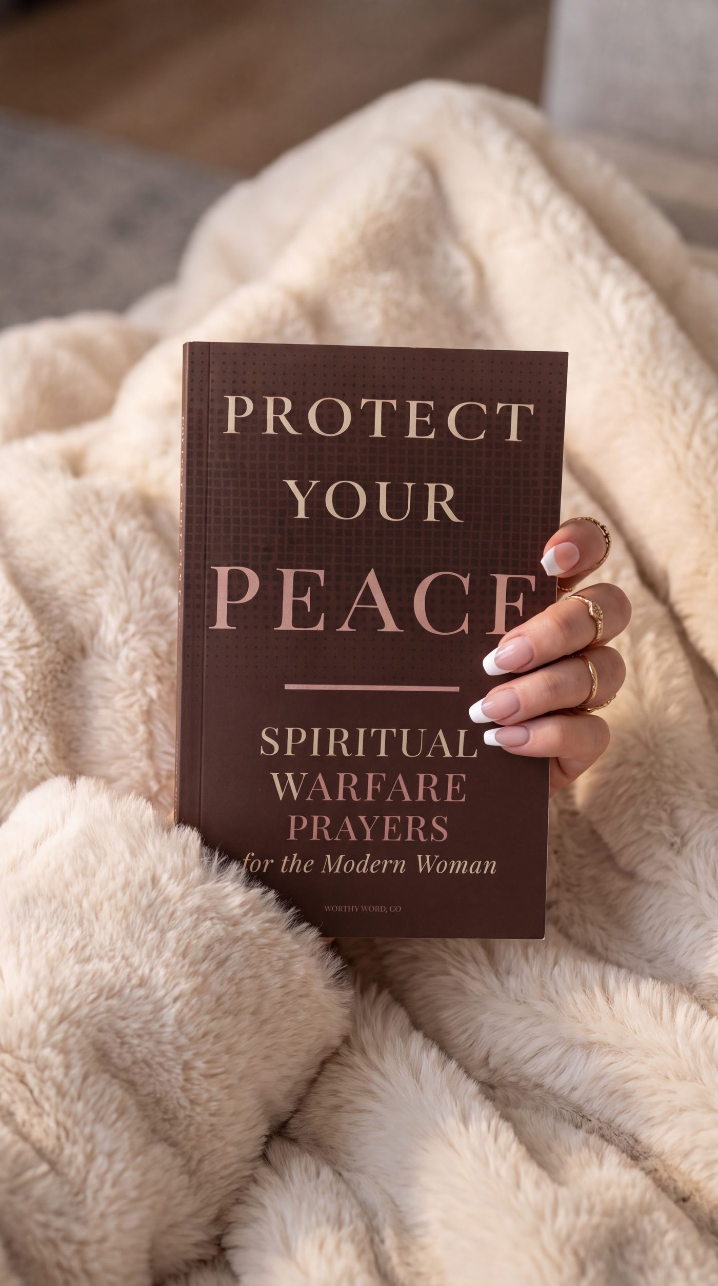 Protect Your Peace held on a cream throw